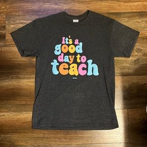 Medium gray t-shirt, “it’s a good day to teach”